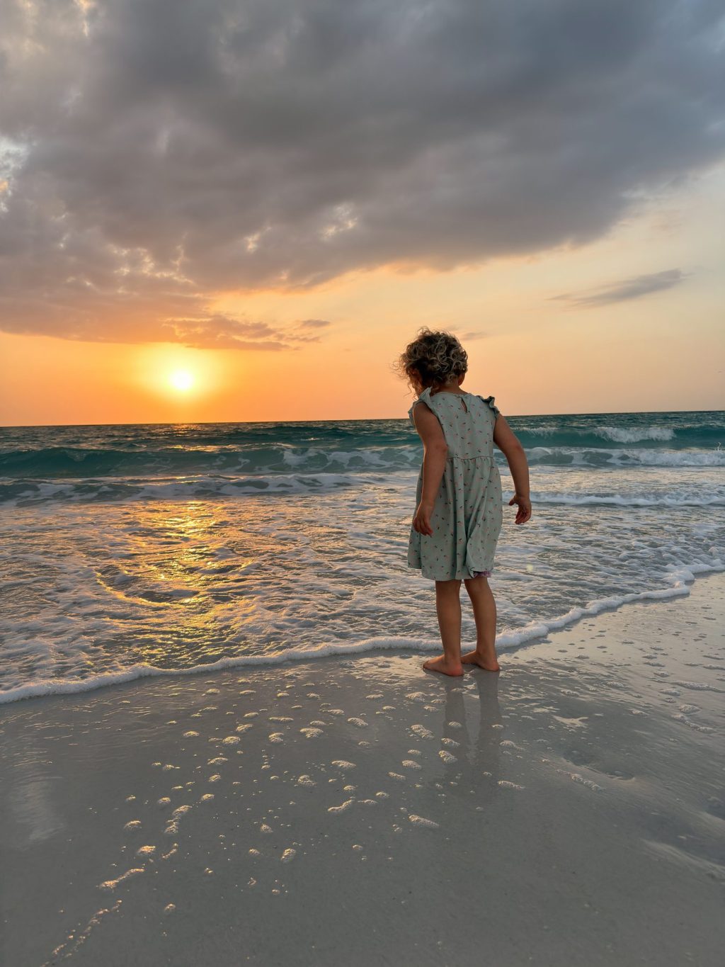 Emery watching the sunset on a Florida beach
