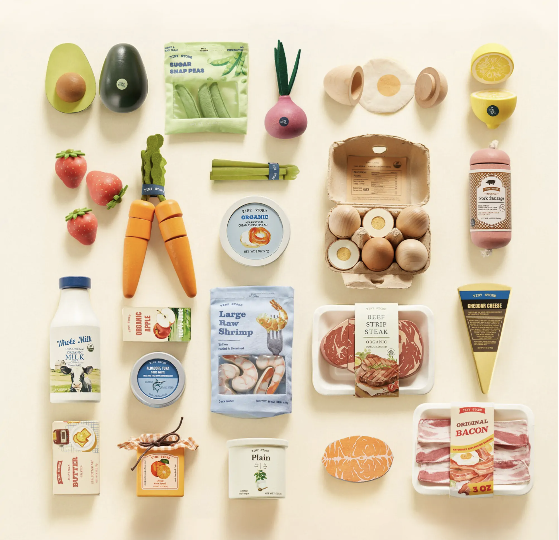 Realistic wooden play food set including meat, dairy, fruits, and vegetables, product photo.